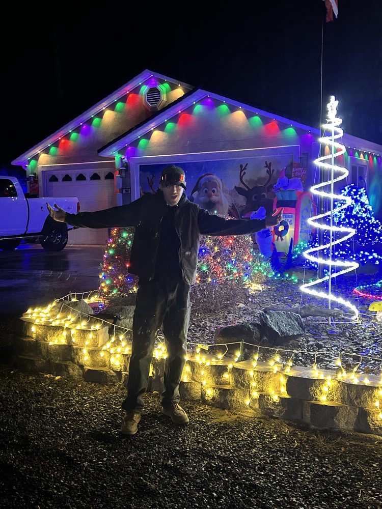 RNKS Services crew installing professional Christmas lights on a roofline in Reno NV